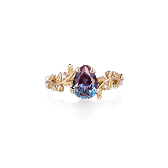 Elegant gold alexandrite ring with leaf motifs and diamond accents