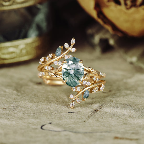 Moss agate and moissanite engagement ring with vine-like design