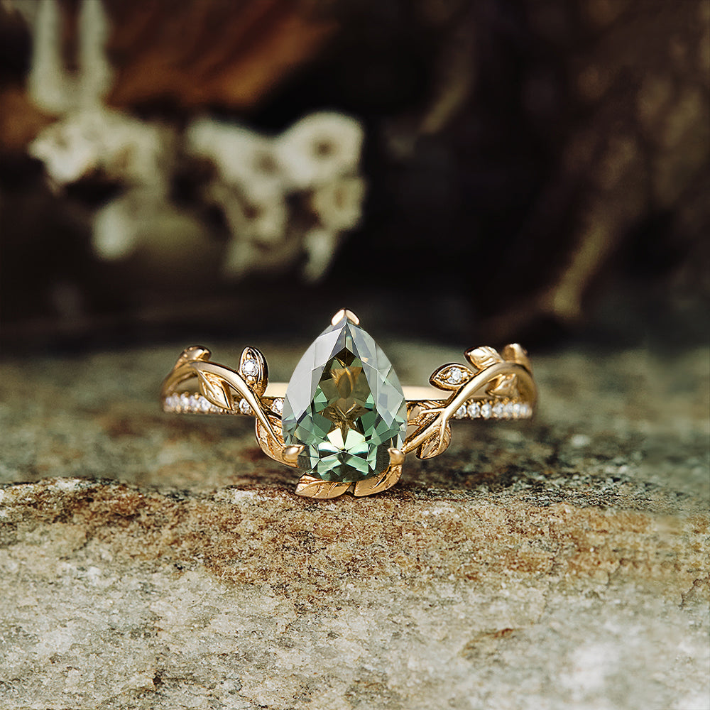 Pear-shaped lab-grown green sapphire ring with nature-inspired design