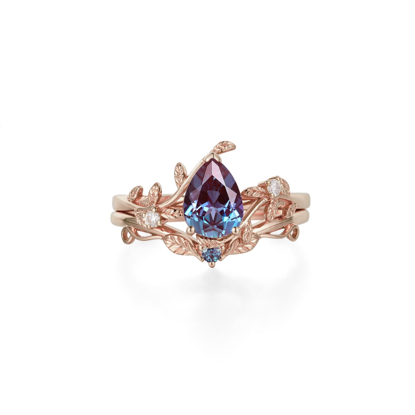 Pear-shaped lab alexandrite engagement ring with moissanite in rose gold leaf setting.