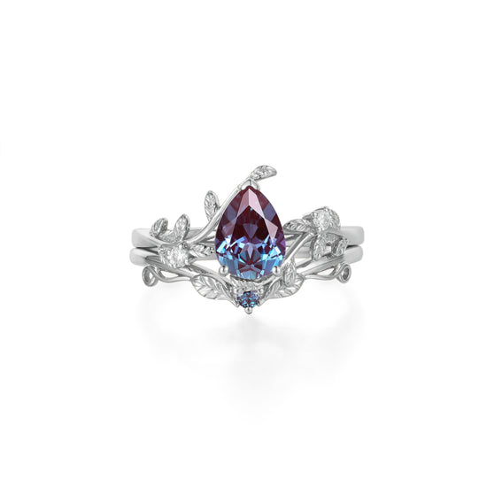 Nature-inspired engagement ring set featuring pear lab alexandrite and moissanite accents.