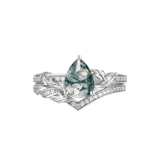 Asymmetric moss agate pear engagement ring with leaf-inspired design and moissanite accents.