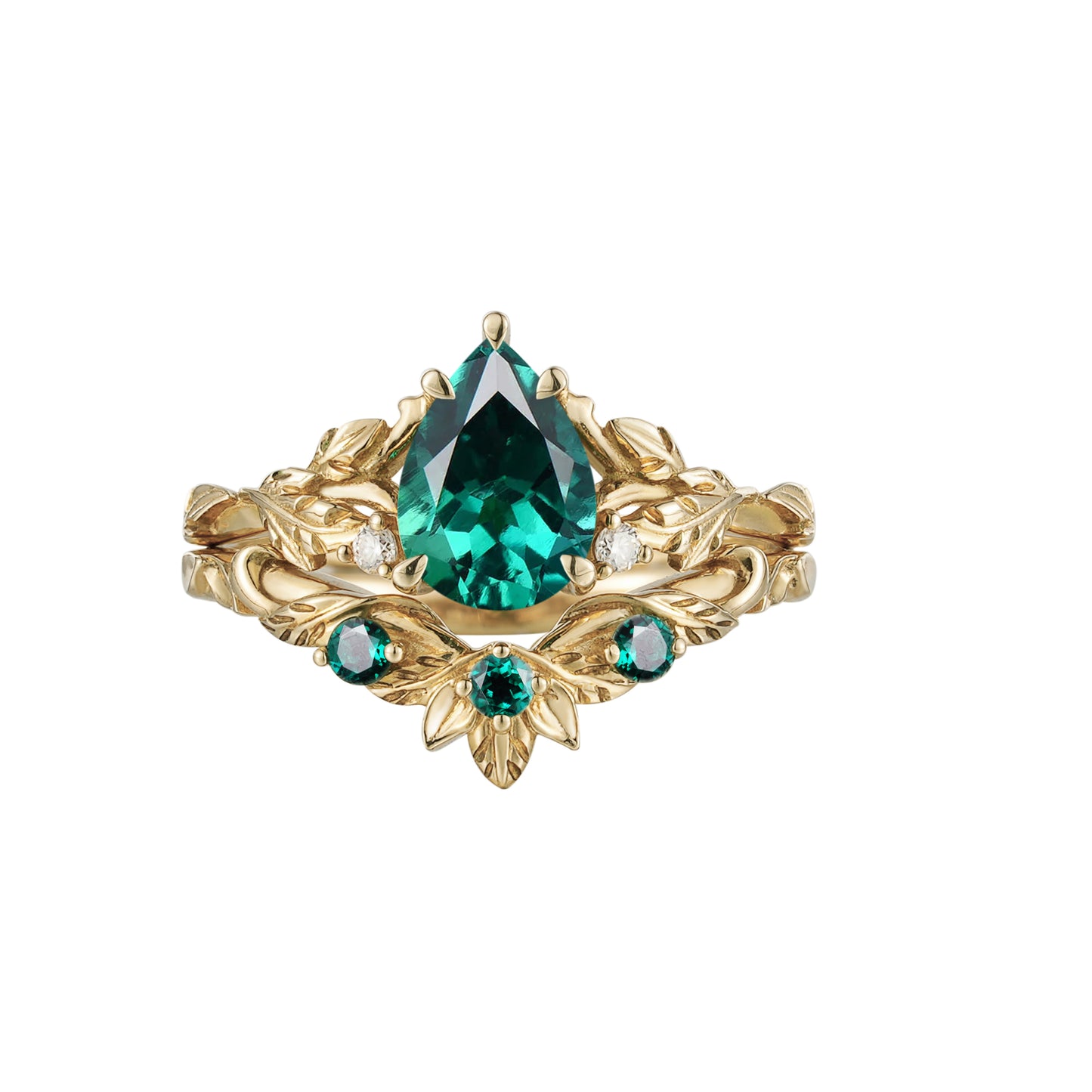 Floral gold engagement ring with pear-cut emerald and green stone accents