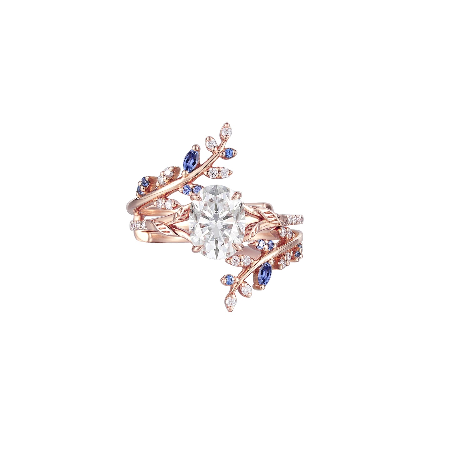 Nature-inspired oval moissanite engagement ring set with sapphire accents and leaf design.