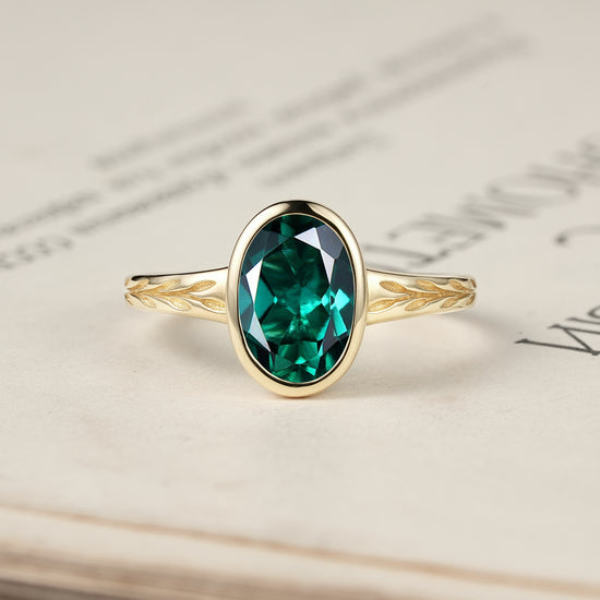 Golden Elegance: Oval Emerald Leaf Ring | Celia