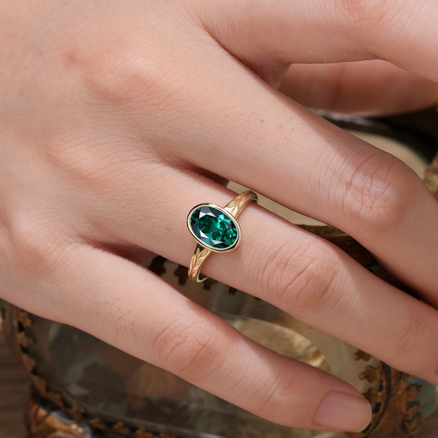 Golden Elegance: Oval Emerald Leaf Ring | Celia