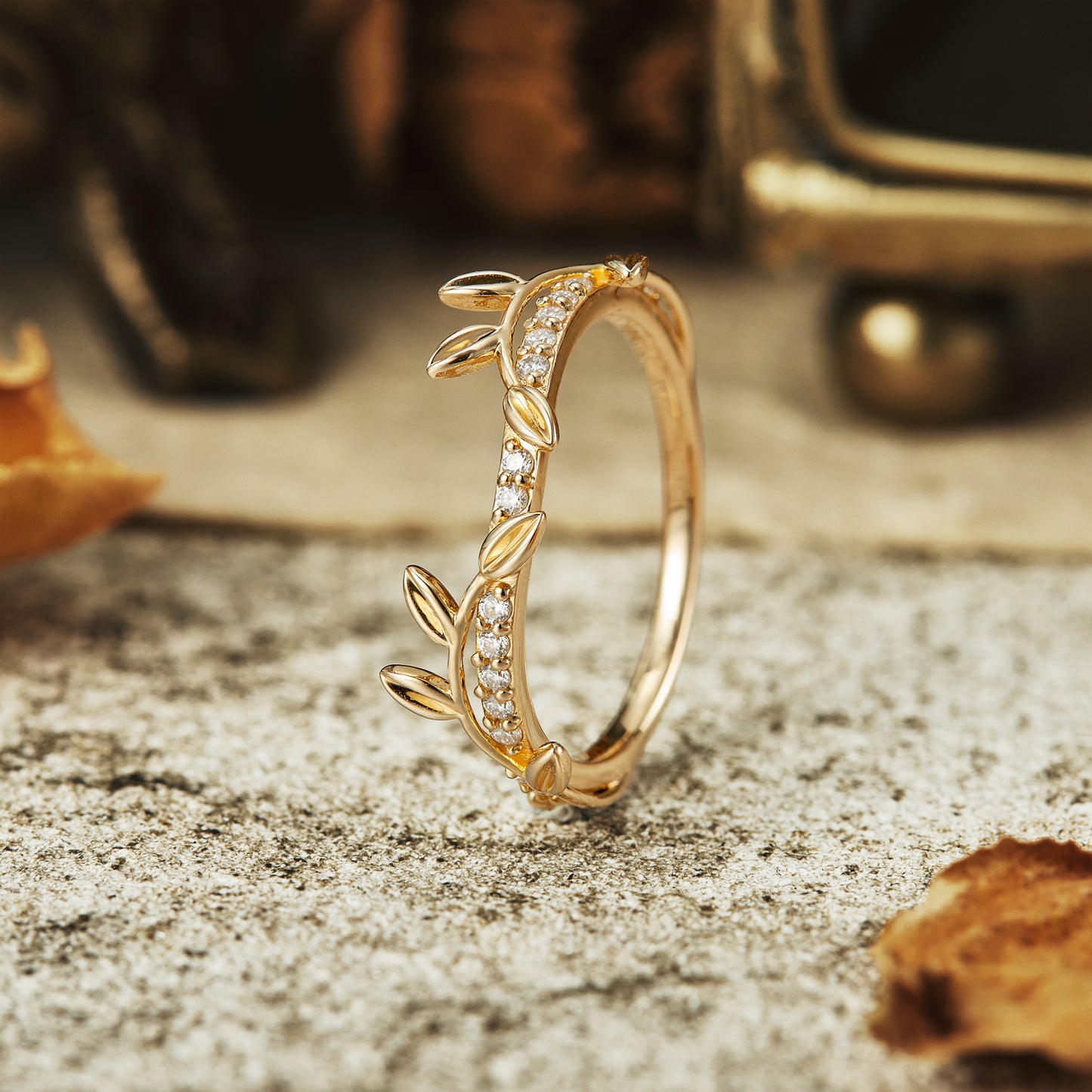 Vine-inspired gold wedding band with sparkling moissanite stones by Gemsmagic