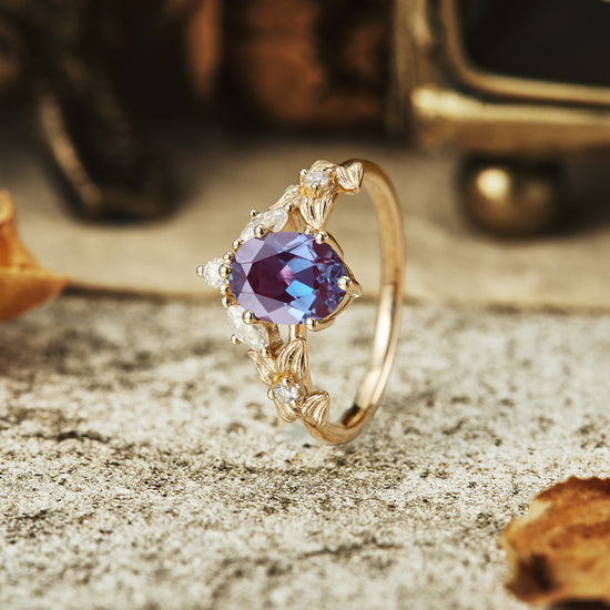 Elegant V-Shaped engagement ring with lab alexandrite and moissanite accents.