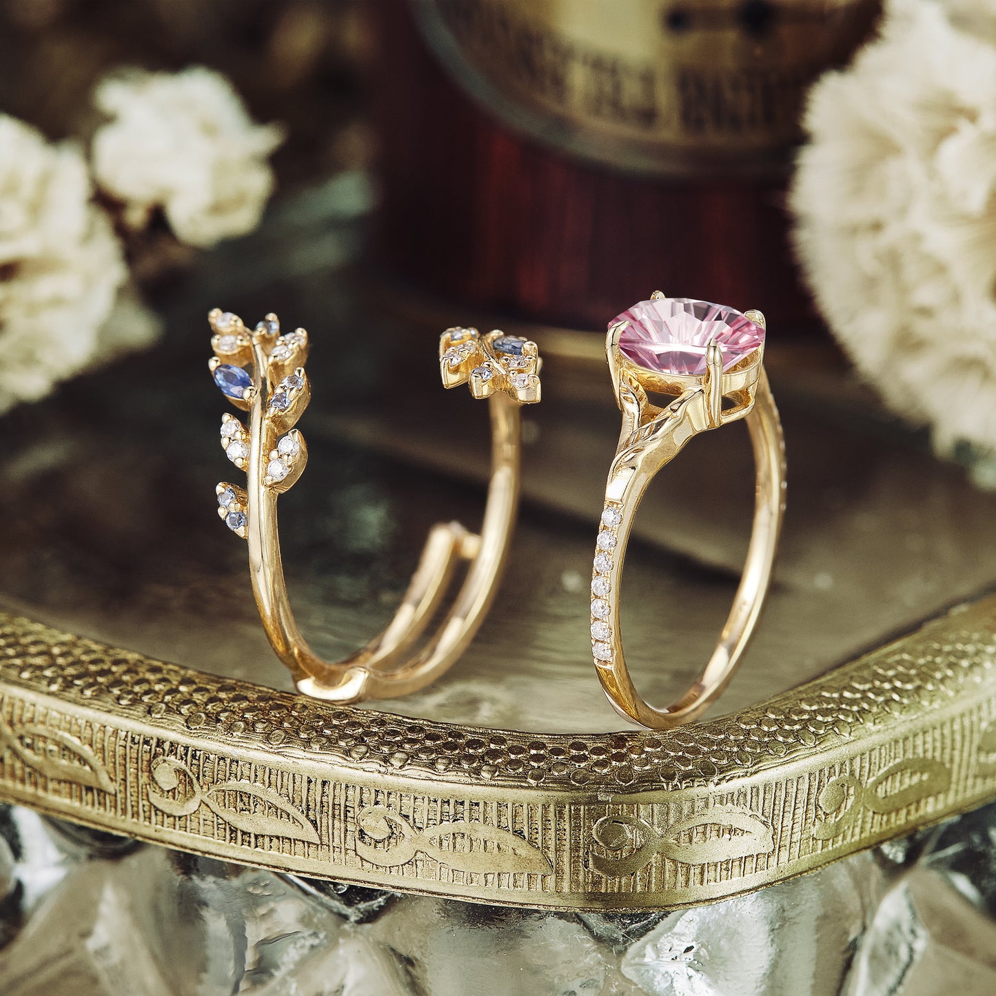 Aphrodite's Enchanted Vine ring set with padparadscha stone and moissanite, gold accents.