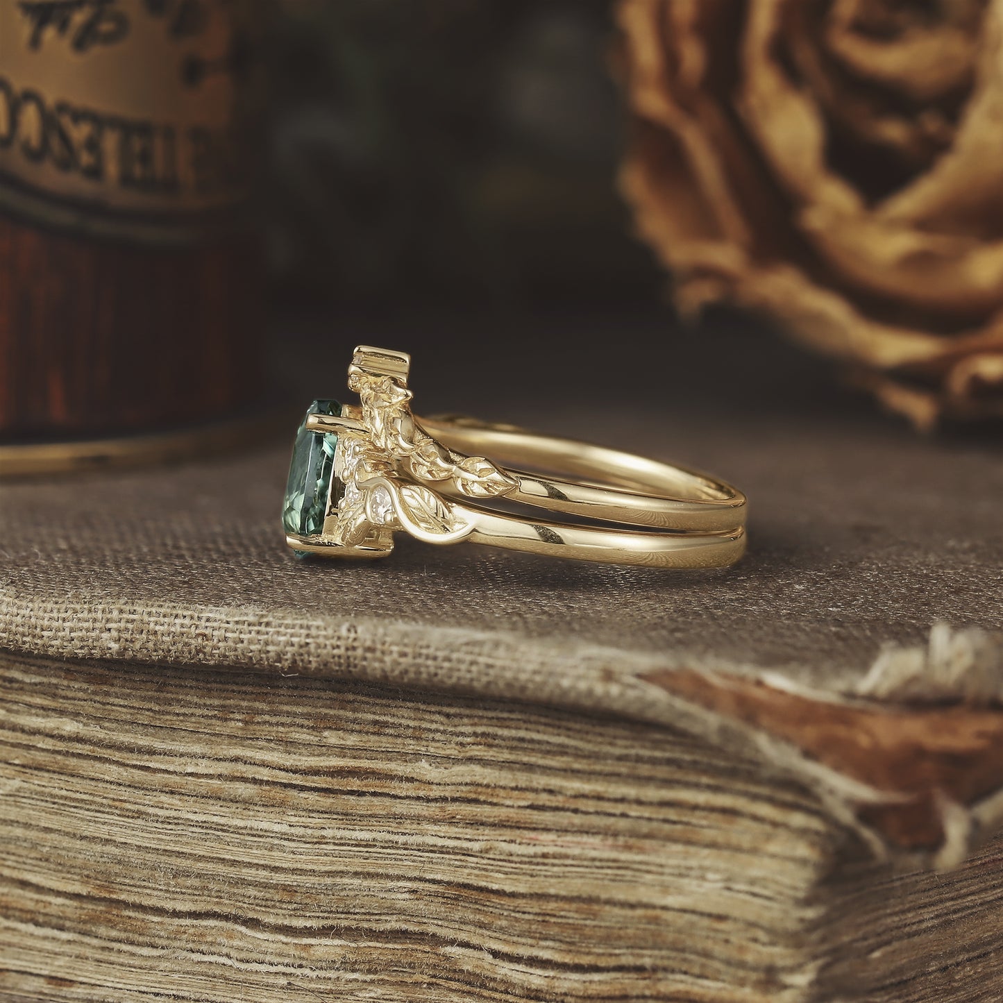 Elegant gold ring set featuring a rectangular lab-created green sapphire and moissanite.