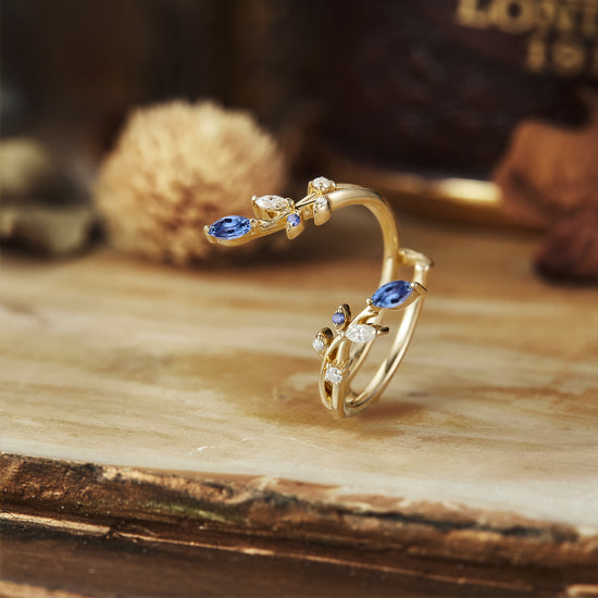 Nature-inspired wedding ring with floral design, featuring sapphires and moissanite