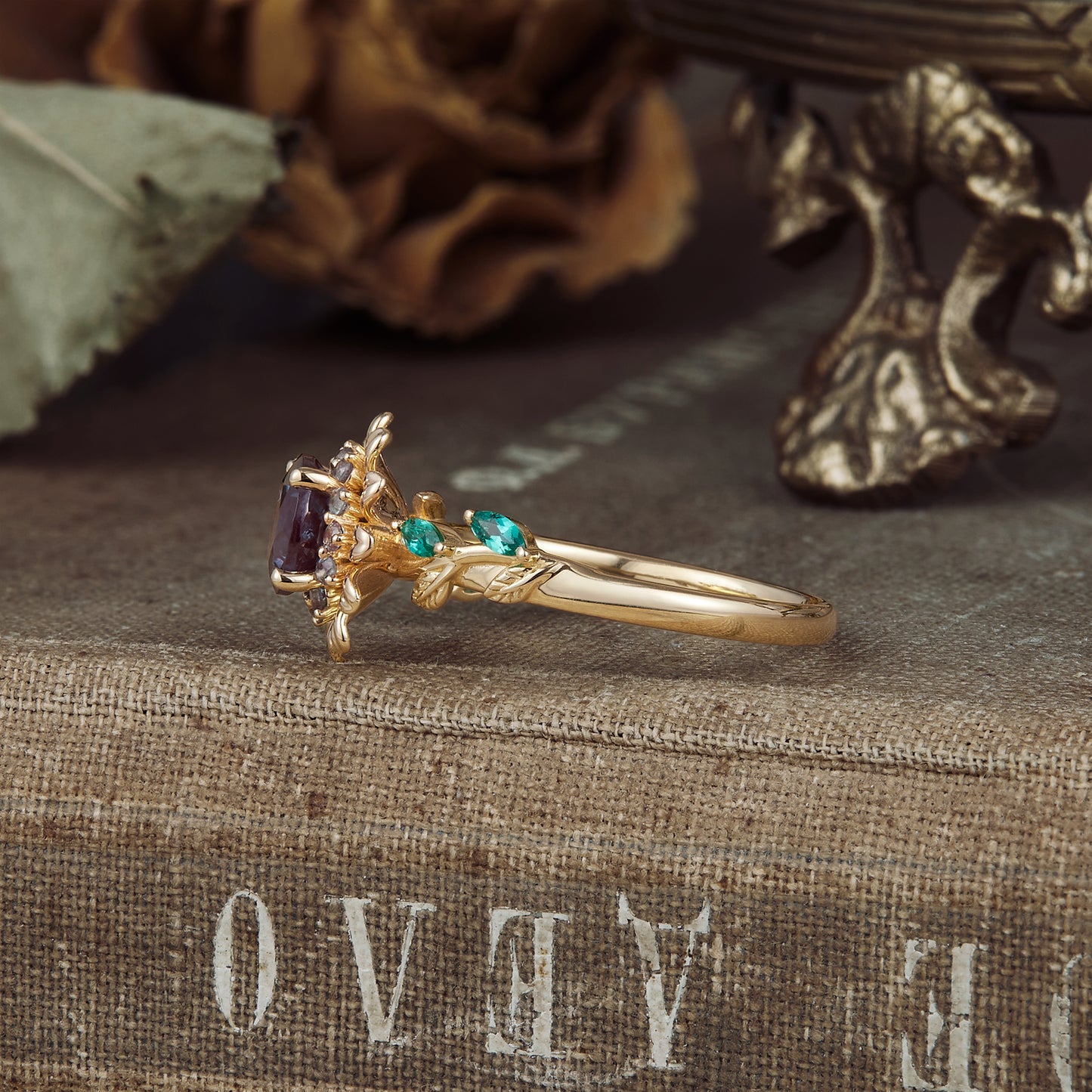 Gold sunflower engagement ring with lab alexandrite and emerald side stones