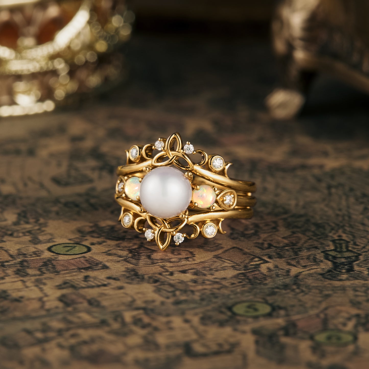 Elegant Akoya pearl ring set with natural opals and moissanite in intricate gold design.