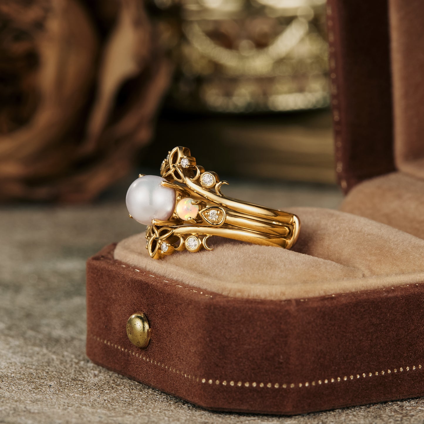 Nature-inspired gold ring set featuring Akoya pearl and sparkling opals.