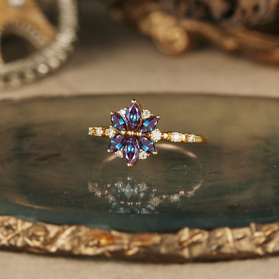 Chrysanthemum-inspired marquise-cut lab alexandrite ring with moissanite accents.