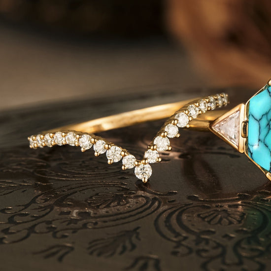 Gold band with diamond accents and turquoise gemstone ring, showcasing intricate design.